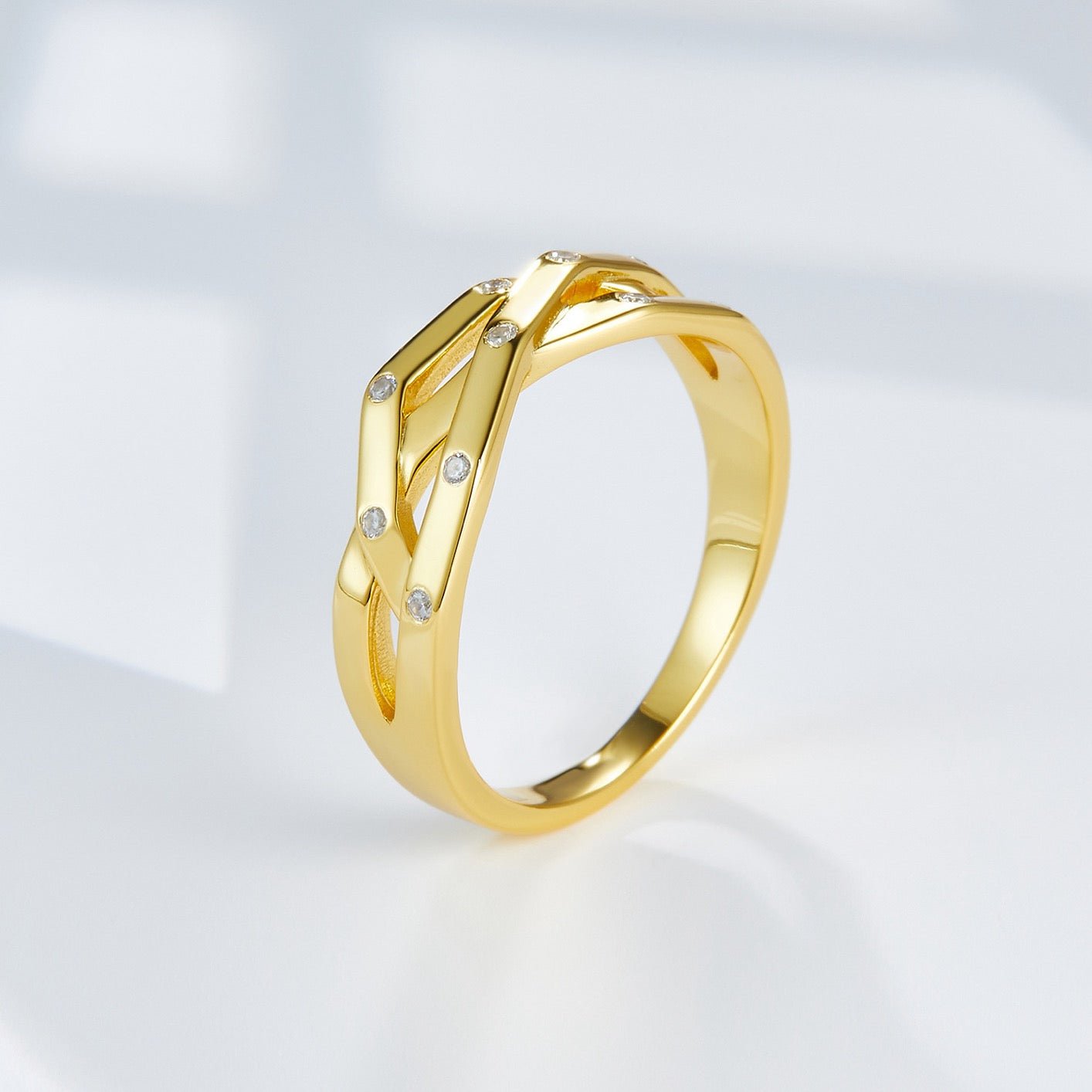Studio side angle of the Awakened Time Trinity Orbit Ring highlighting its fluid multi-band architecture.