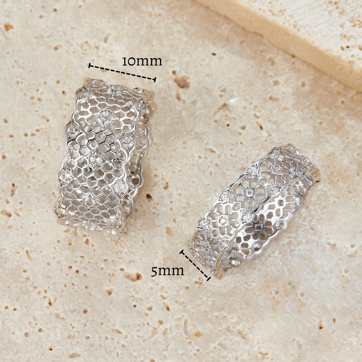 Awakened Time Iceveil Bands shown with measurement overlays: a wide 10mm band (left) and a narrower 5mm band (right), both featuring the intricate Parisian-inspired filigree design in white gold vermeil.