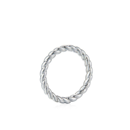 Awakened Time Léa Twist luxury ring in a clean studio product shot, showcasing its polished braided rope design crafted in 18ct recycled white gold plating.