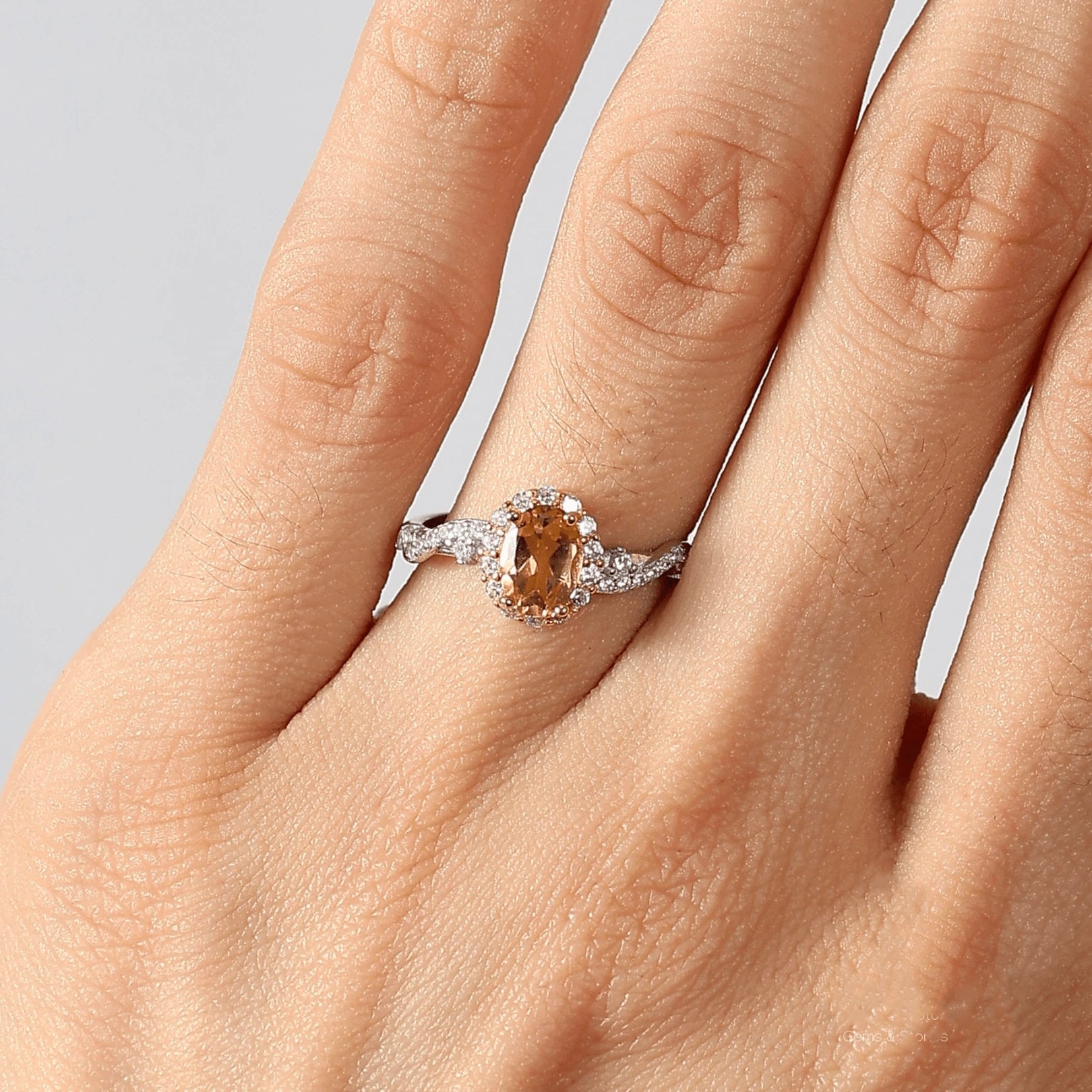 Close-up studio photograph of the Awaken Time Classic Citrine Ring. The ring features an oval-cut natural citrine gemstone set in gold prongs, surrounded by a halo of smaller white cubic zirconia. The band is crafted from polished 925 sterling silver in a vine-like, adjustable open design, shown on a white background.