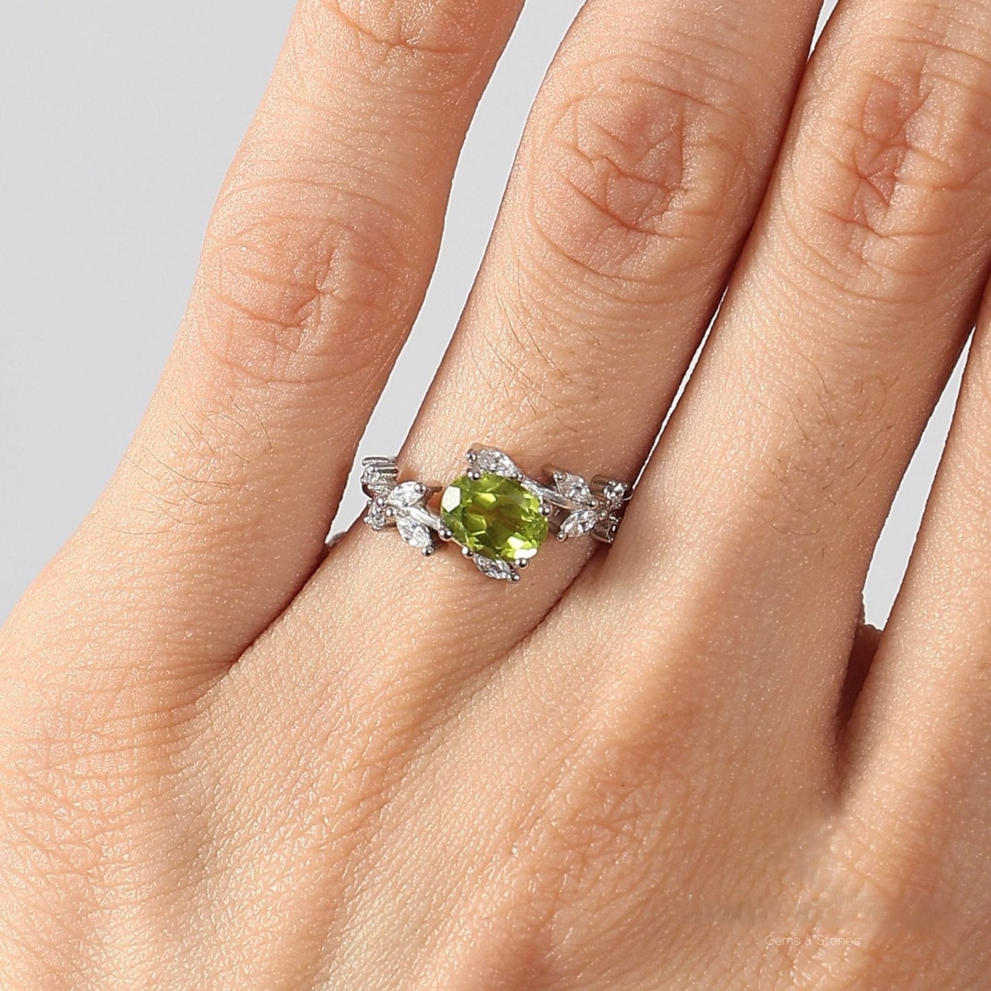 Awaken Time Floral Ring featuring a natural peridot gemstone in a petal-inspired 925 sterling silver setting with sparkling cubic zirconia accents.