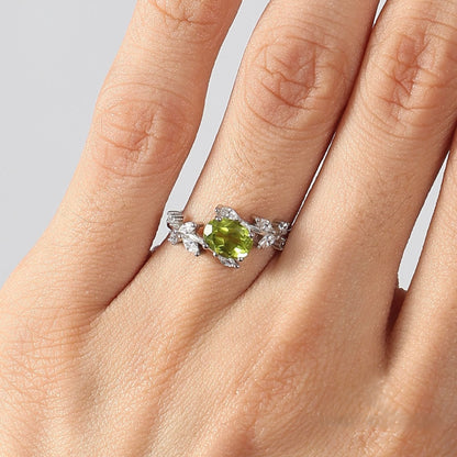Awaken Time Floral Ring featuring a natural peridot gemstone in a petal-inspired 925 sterling silver setting with sparkling cubic zirconia accents.