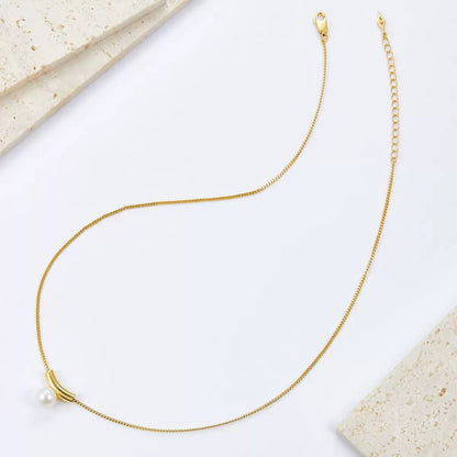 Flat lay shot displaying the full chain layout and clasp of the Awakened Time Arc de Lune necklace.