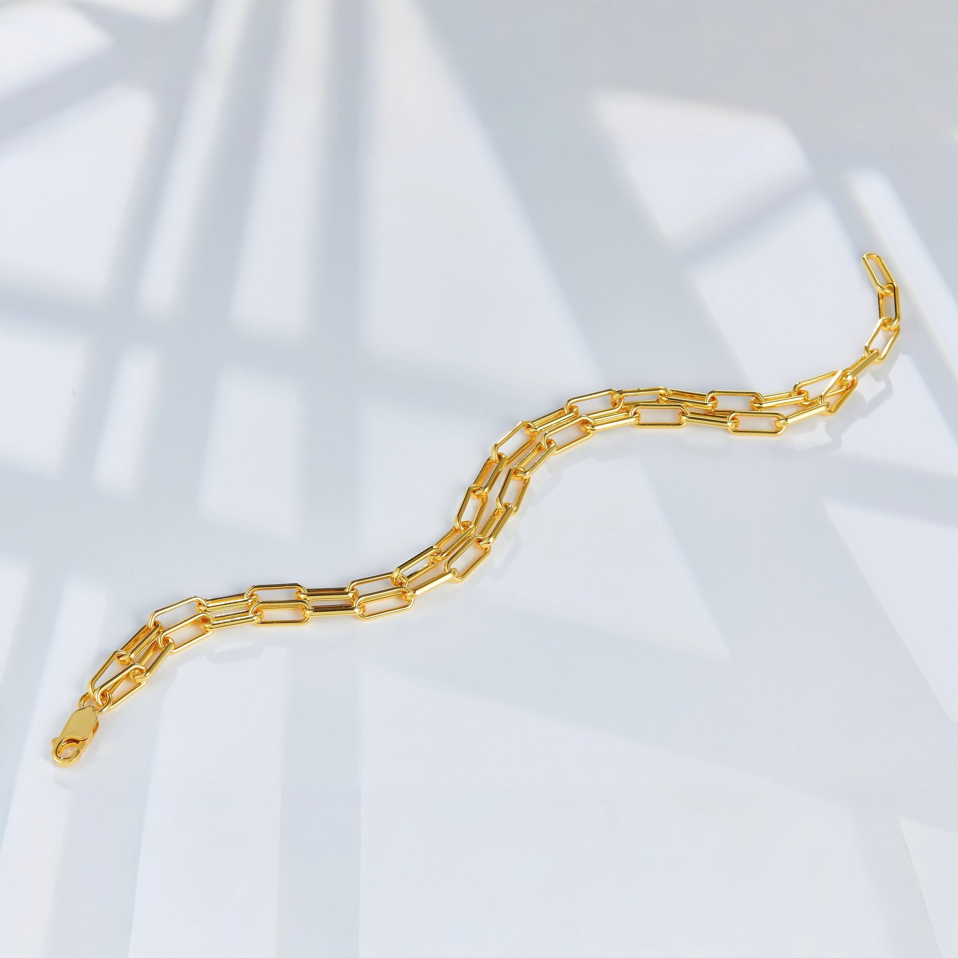 Auréole Double Paperclip Bracelet by Awakened Time showcasing a modern double paperclip chain design crafted in 18ct gold vermeil over 925 sterling silver.