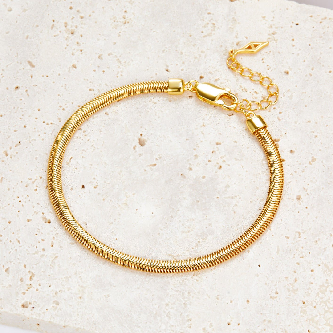 Close-up of the Awakened Time Bare Luxe Essential Chain Bracelet crafted in 925 sterling silver with a durable 18ct recycled gold vermeil finish.