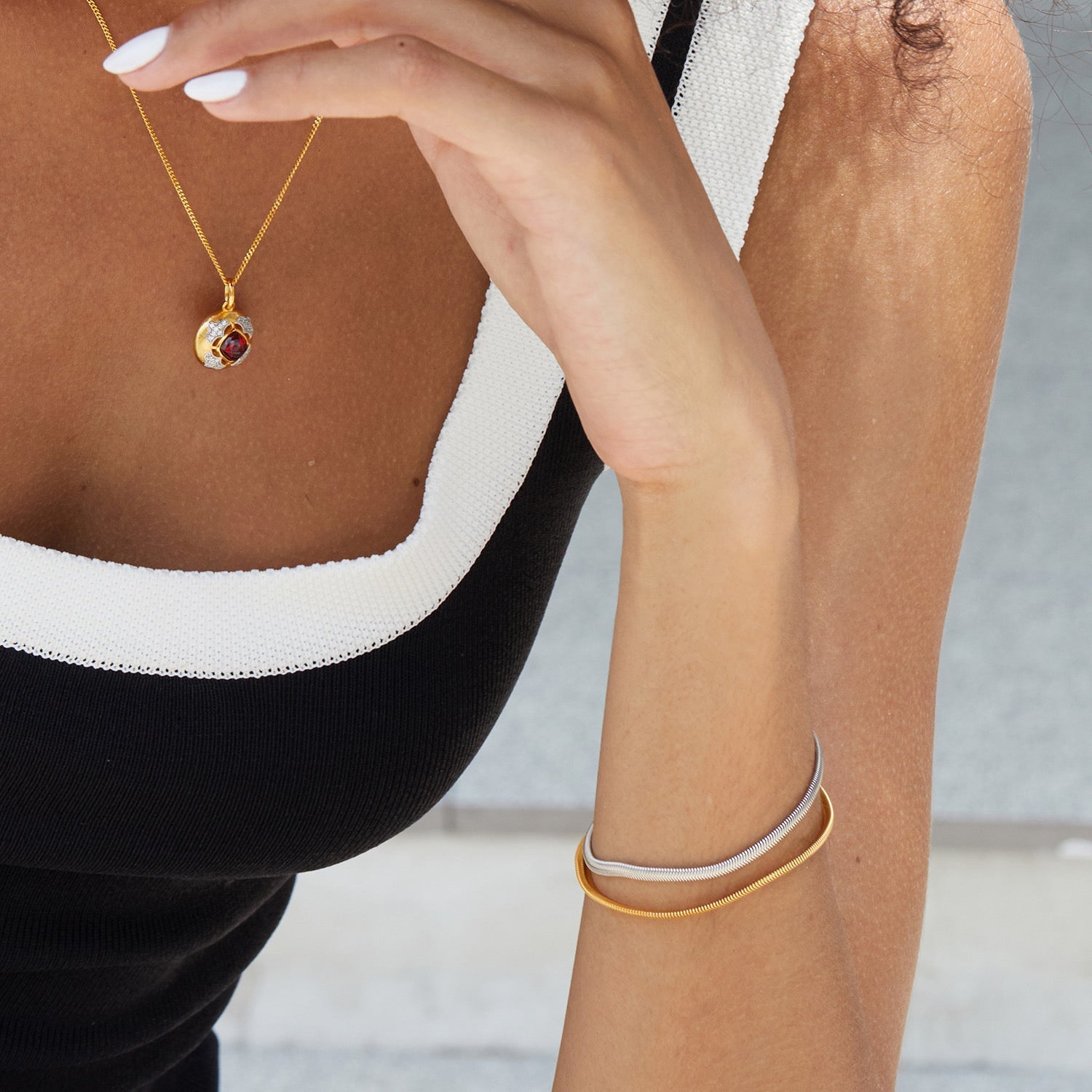 Close-up of a woman wearing the Awakened Time Bare Luxe Essential Chain Bracelet featuring a sleek minimalist chain design in 18ct gold vermeil and sterling silver.