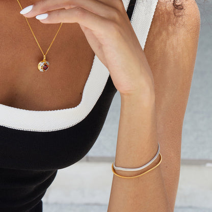 Close-up of a woman wearing the Awakened Time Bare Luxe Essential Chain Bracelet featuring a sleek minimalist chain design in 18ct gold vermeil and sterling silver.