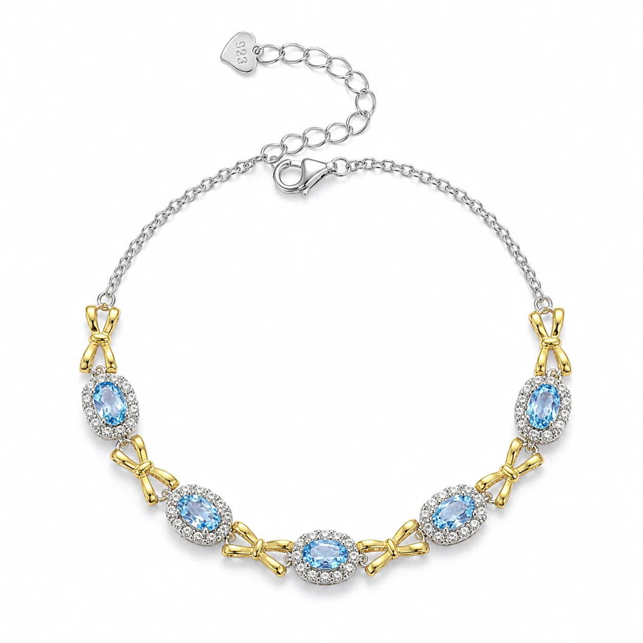 Awakened Time Bluelace Bracelet in S925 sterling silver with four oval natural blue topaz gemstones, gold tone bow details, and a delicate luxury jewelry design.