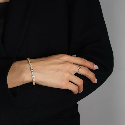 Close-up of a woman wearing the Awakened Time Classic Citrine Bracelet, a sterling silver gemstone bracelet with natural citrine and sparkling zirconia accents.