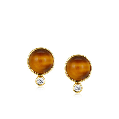 Pair of Awakened Time Ember Gleam round gold stud earrings featuring cabochon natural Tiger's Eye gemstones with small bezel-set cubic zirconia drops on a white background.