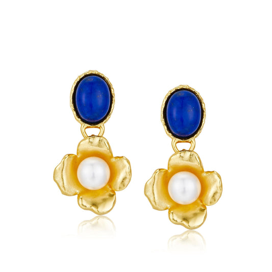 Pair of Awakened Time Fleur de Lapis drop earrings featuring cabochon blue lapis lazuli top studs suspending gold flower drops with centered white freshwater pearls on a white background.