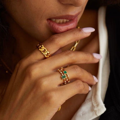 Model wearing stacked gemstone rings from the Paris-born Awakened Time collection.