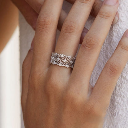 Close-up of the Awakened Time Iceveil Wide Band Ring featuring an intricate honeycomb lattice texture in 18ct white gold vermeil over 925 sterling silver.