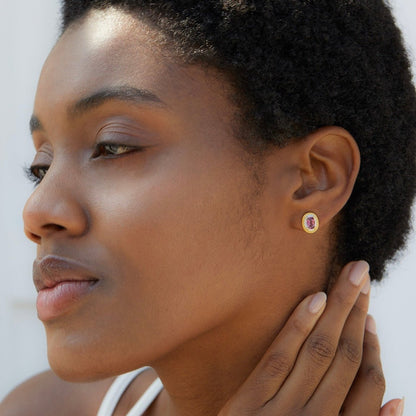 Side profile of a model wearing the Awakened Time Imperial Romance garnet stud earrings.