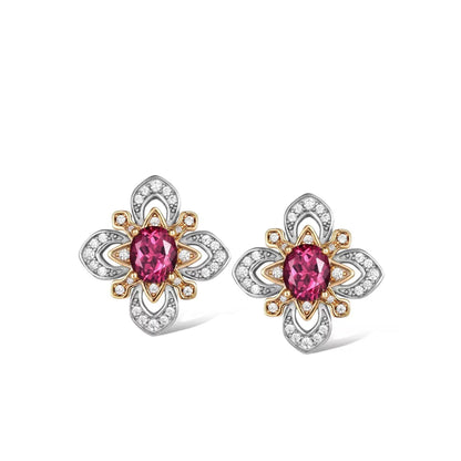Pair of Awakened Time La Rosa di Firenze two-tone stud earrings featuring oval red garnets encircled by gold petal frames and silver pavé zirconia borders on a white background.
