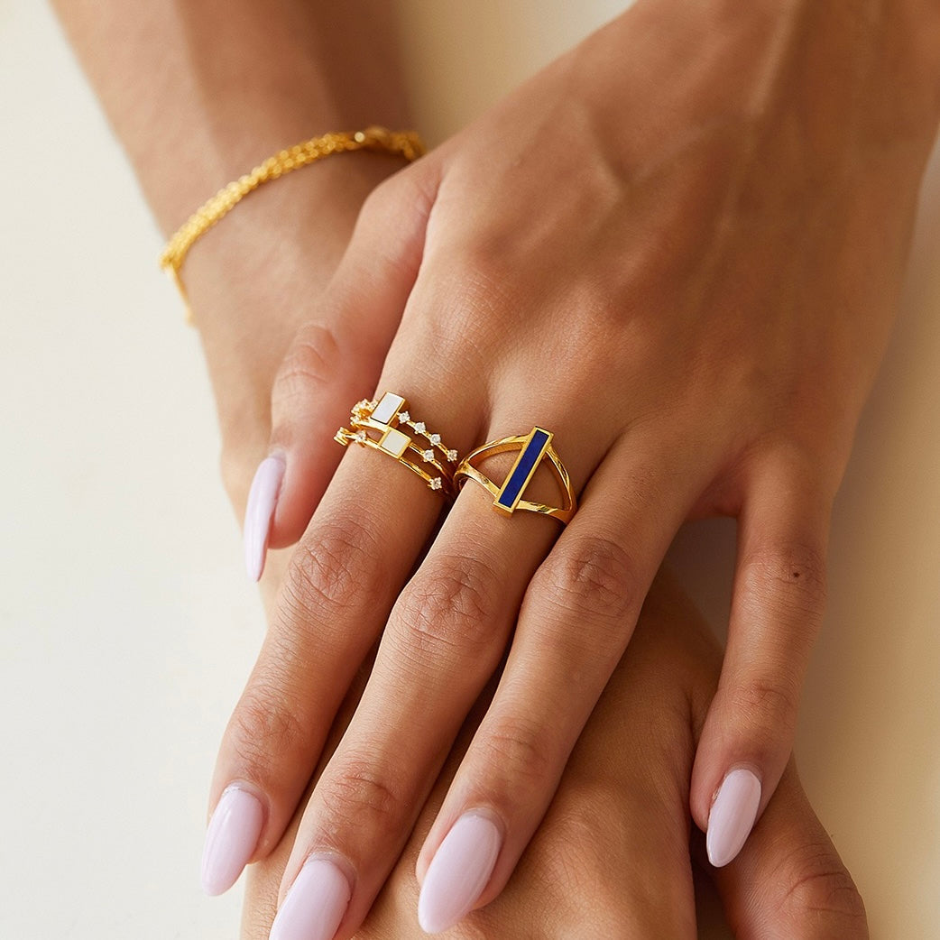 Model showcasing layered Awakened Time gemstone rings with lapis lazuli.