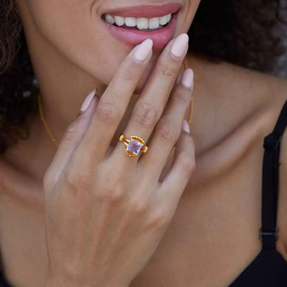 Portrait of a model showcasing The Lilac Crown Ring as part of Awakened Time's luxury everyday collection.