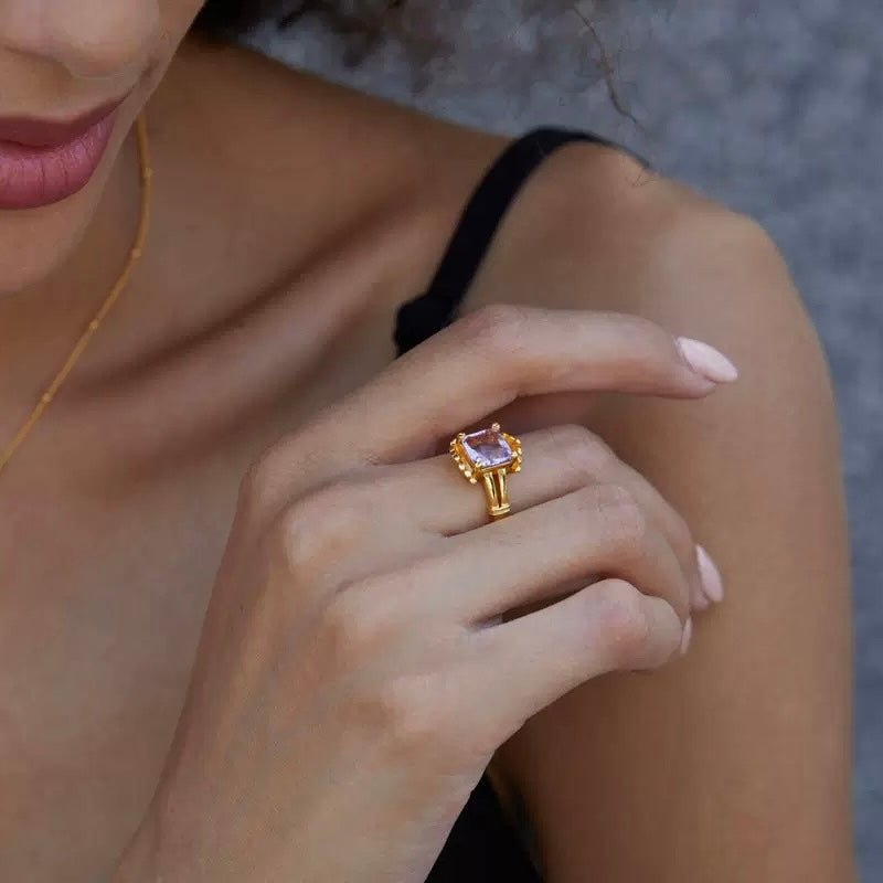 Side profile view of a model wearing The Lilac Crown Ring by Awakened Time.