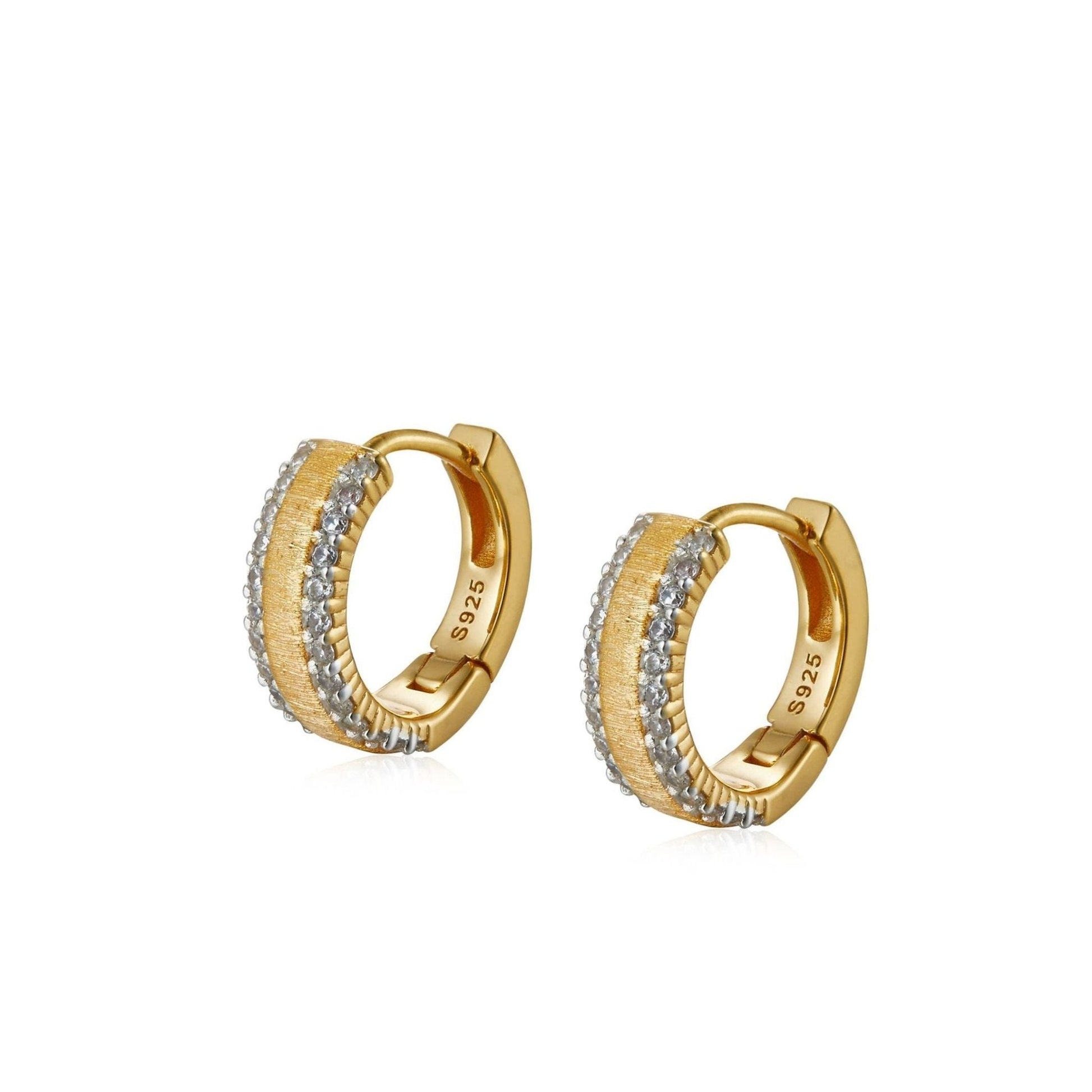 Pair of Awakened Time Lumière huggie hoop earrings featuring a brushed gold center stripe flanked by double rows of cubic zirconia with S925 hallmark on a white background.