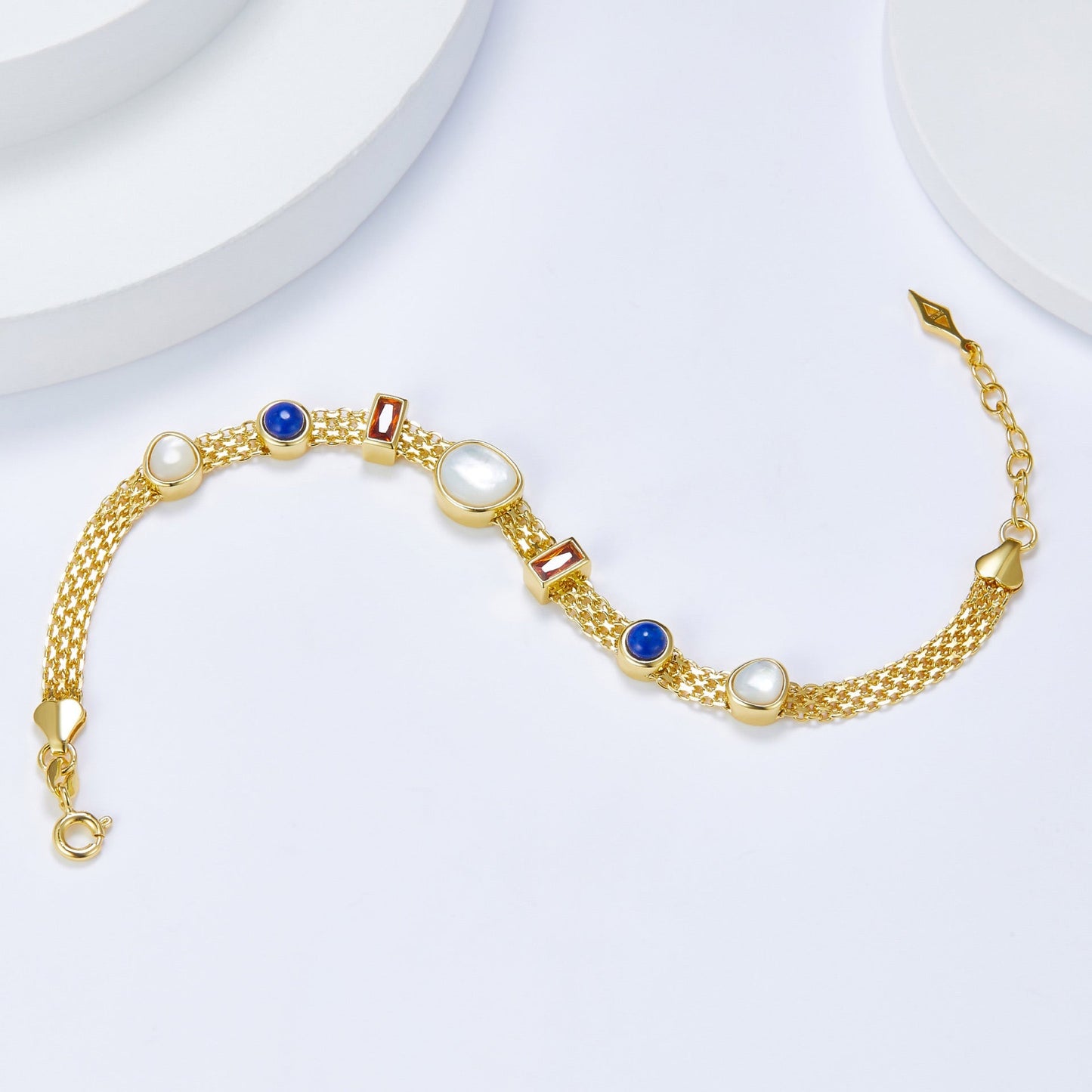 Awakened Time Lumière Strand Bracelet crafted in 925 sterling silver with 18ct gold vermeil finish and a colorful arrangement of natural garnet, lapis lazuli, and mother-of-pearl gemstones.