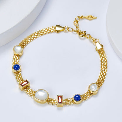Lumière Strand Bracelet by Awakened Time crafted in 925 sterling silver with 18ct gold vermeil finish and natural garnet, lapis lazuli, and mother-of-pearl gemstone accents.