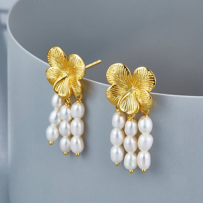 Both Awakened Time gold floral pearl cascade earrings displayed upright against a neutral background.