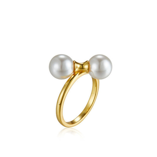 Studio product shot of The Petite Symétrie Ring by Awakened Time featuring dual shell pearls on an 18ct gold vermeil band.