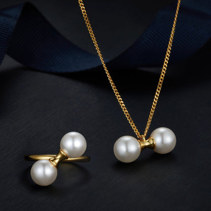 Matching 18ct gold vermeil pearl jewelry set featuring The Petite Symétrie ring and necklace by Awakened Time.