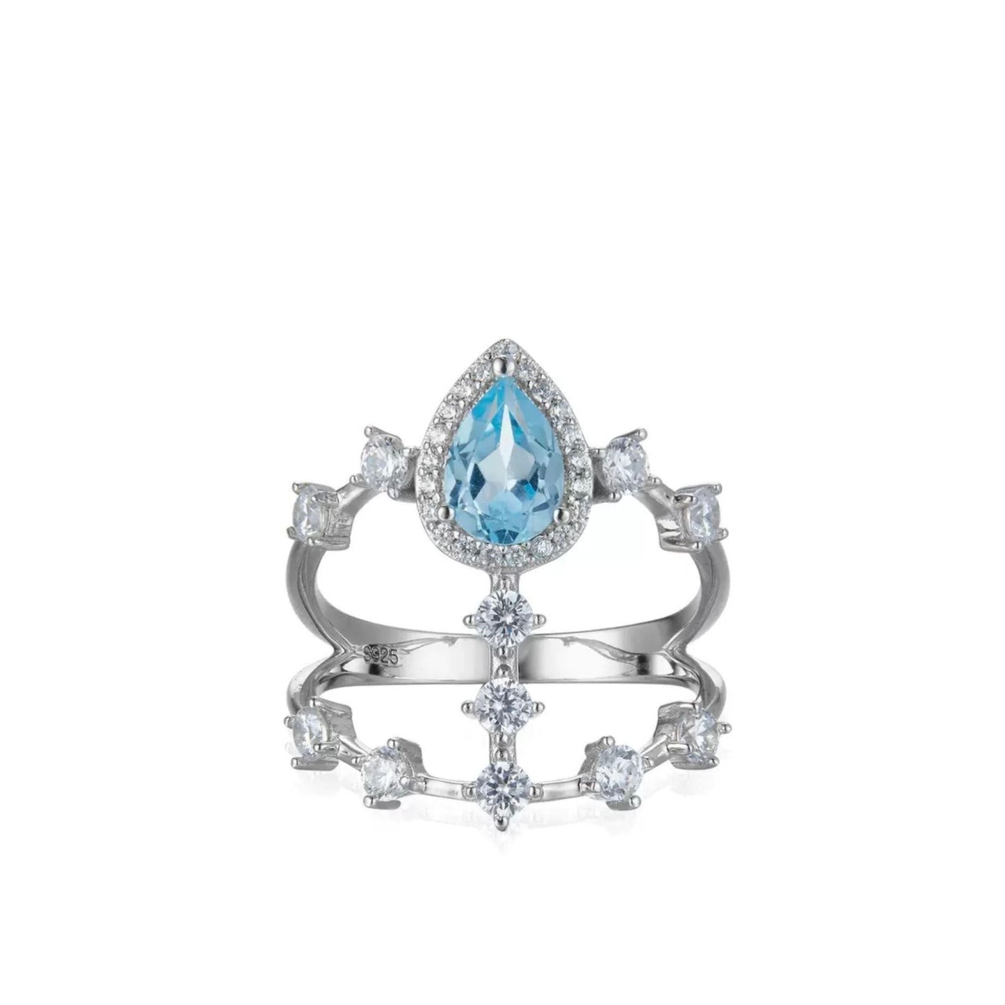 Awakened Time Sky Vault Ring in white gold vermeil featuring a central pear-cut blue topaz surrounded by cubic zirconia in a sculptural openwork setting.