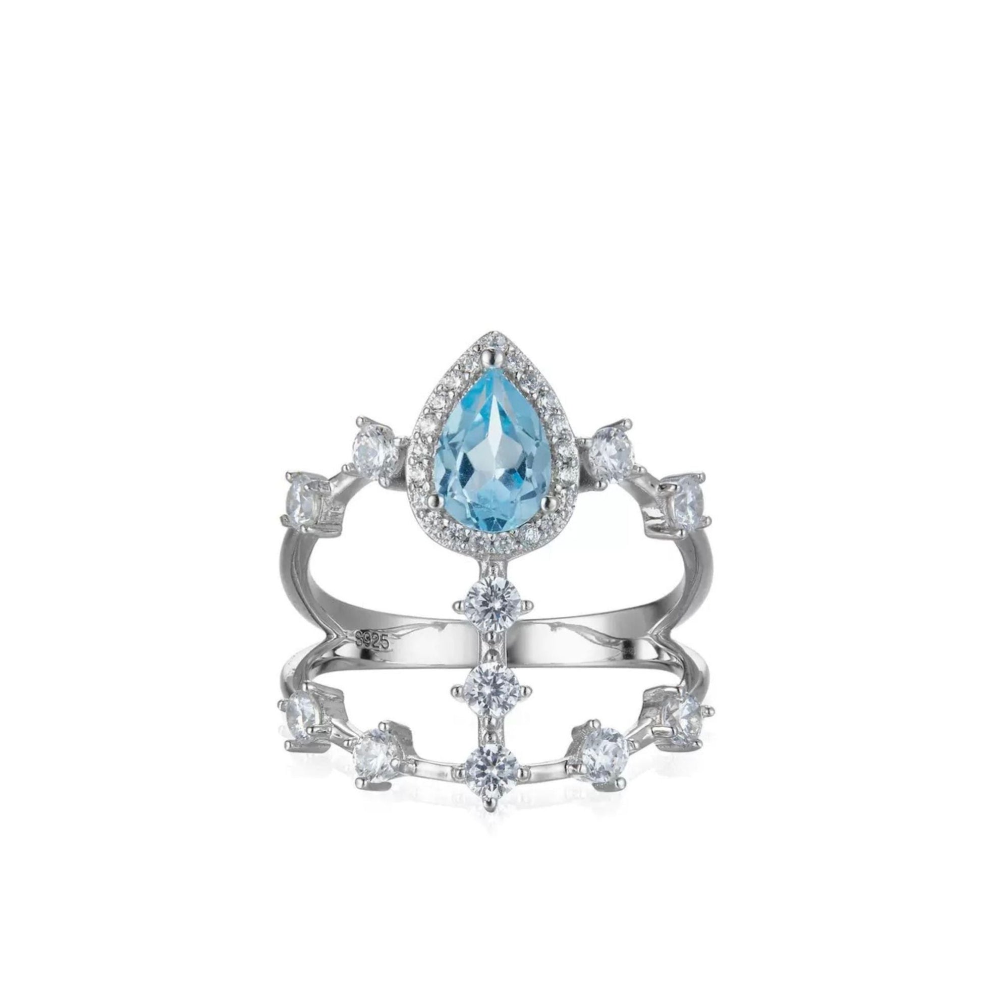 Awakened Time Sky Vault Ring in white gold vermeil featuring a central pear-cut blue topaz surrounded by cubic zirconia in a sculptural openwork setting.