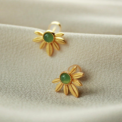 Rear perspective of Awakened Time Songe de Marguerite floral gold vermeil stud earrings showing the post backings.