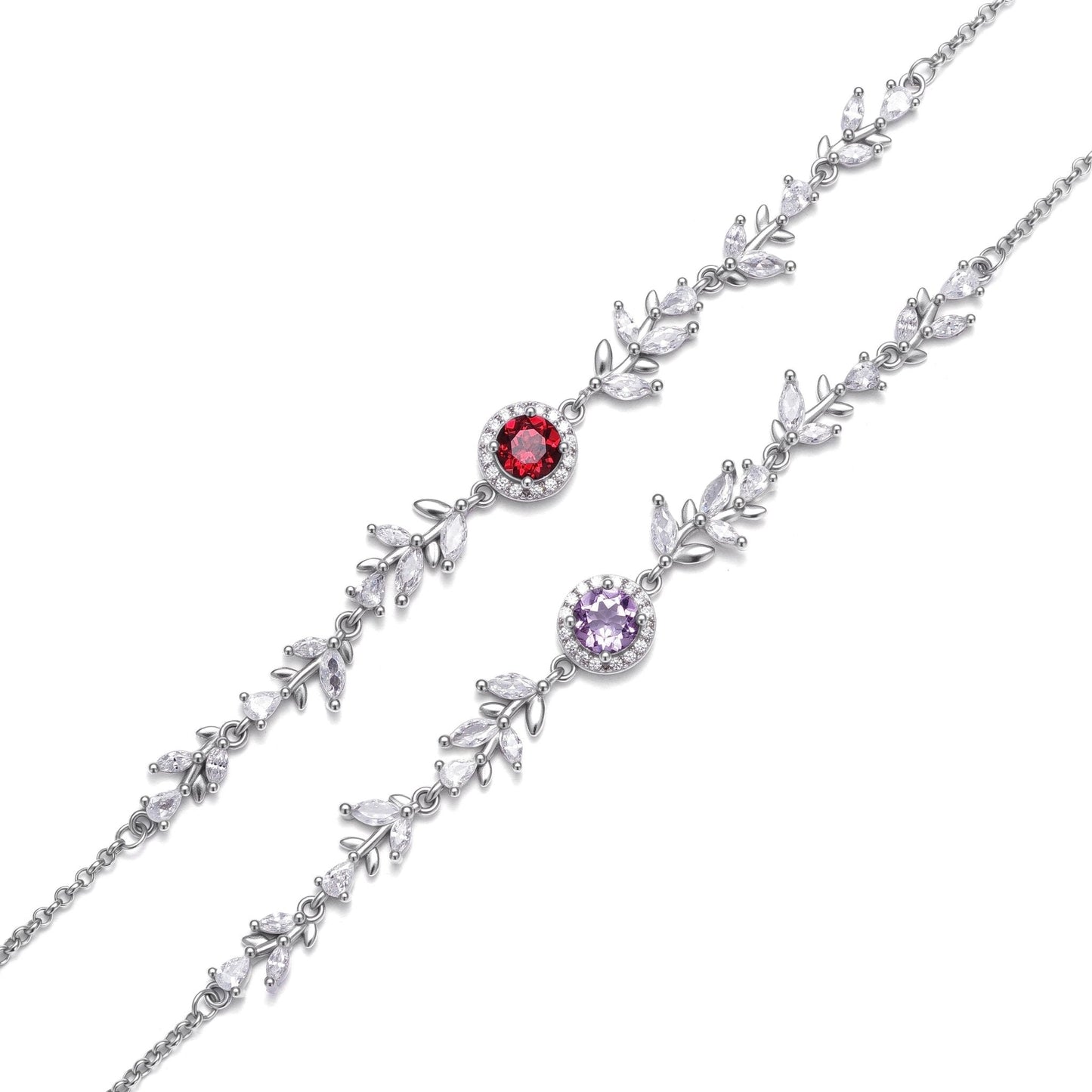 Two Awakened Time Wheatline sterling silver bracelets displayed side by side, featuring leaf-like cubic zirconia links and central gemstone options in deep red garnet and light purple amethyst.