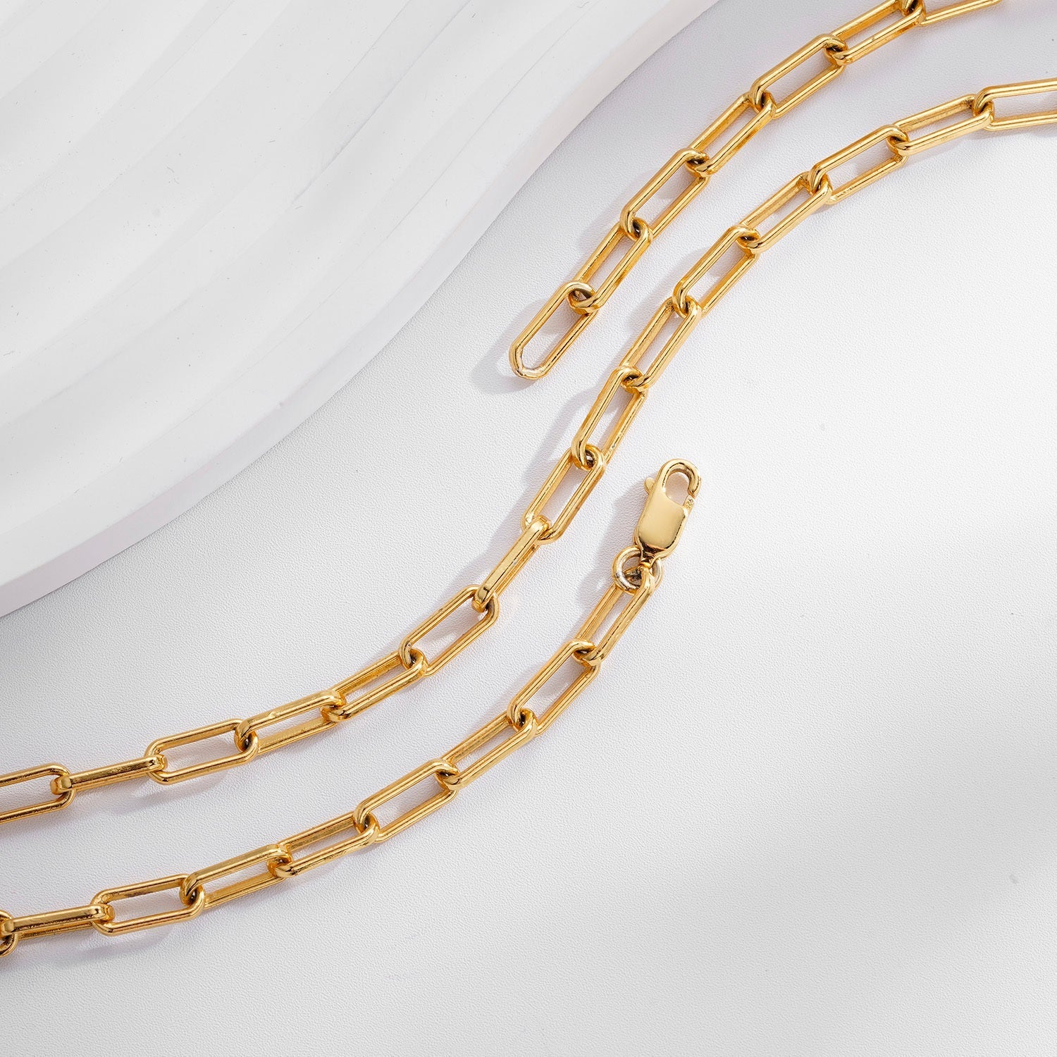 Close-up of Bare Luxe gold vermeil paperclip chain links