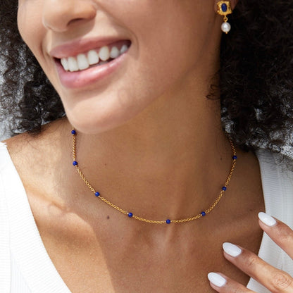 Blue Orbit lapis lazuli necklace worn on model