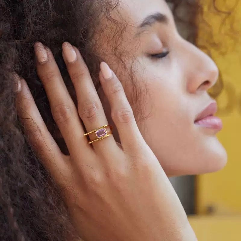 Model posing with the Cadre de Violette gold vermeil ring highlighting its Parisian elegance and modern geometry.