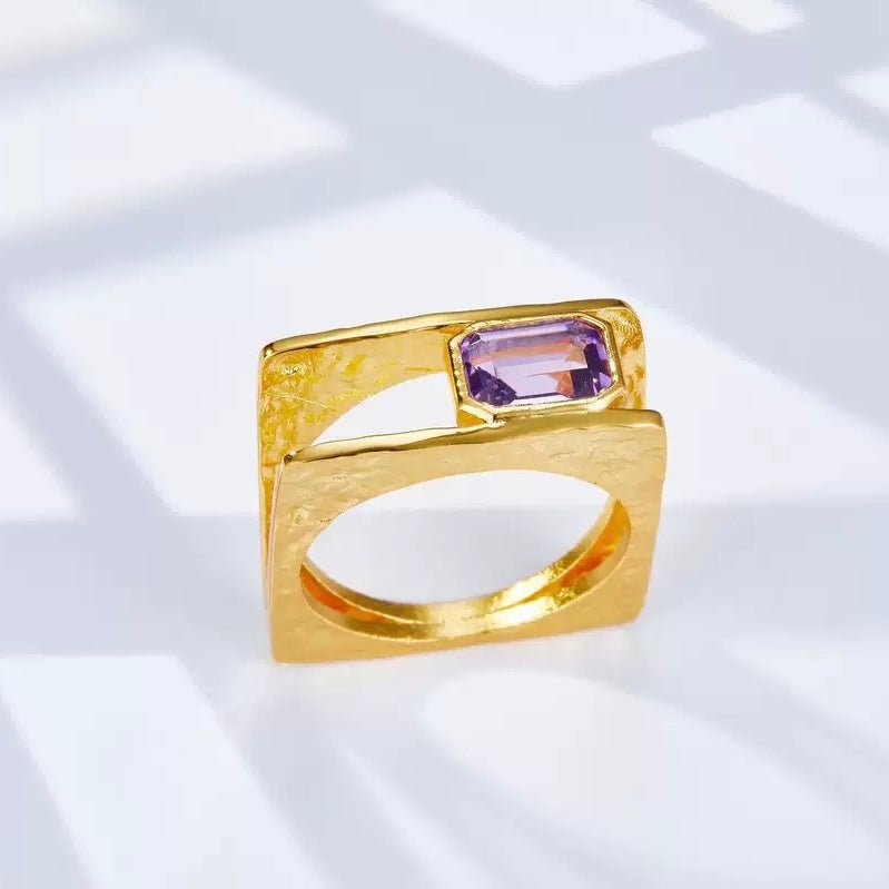 Cadre de Violette gold vermeil amethyst ring displayed under soft natural sunlight and shadow patterns.