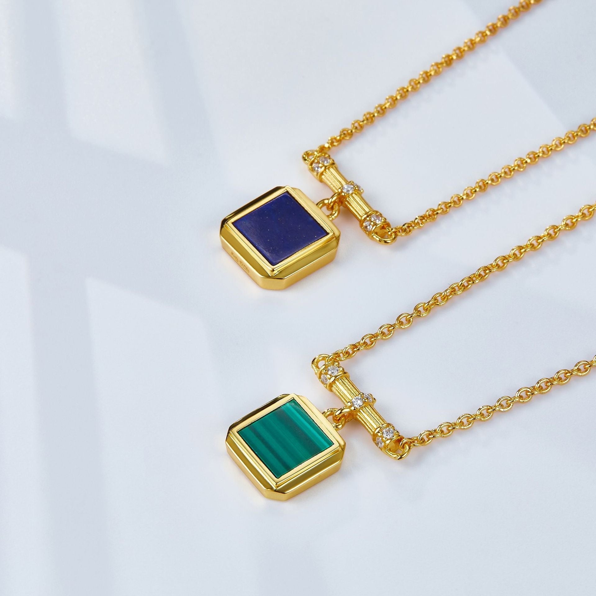 Angle view of the Garden Square gemstone pendant necklaces in blue lapis lazuli and green malachite