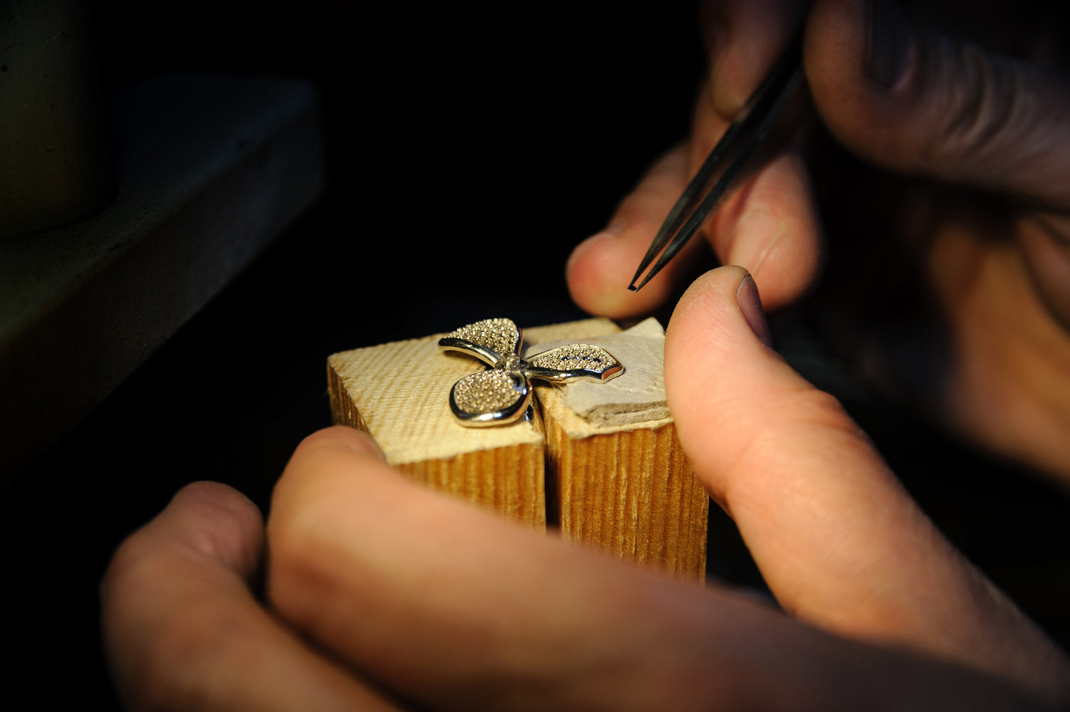 Handcrafted gold vermeil butterfly ring being refined by a jeweler, highlighting artisan jewelry craftsmanship at Awakened Time.