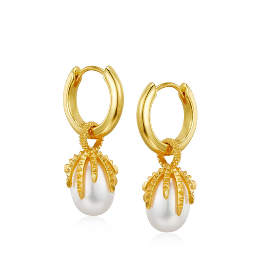 Pair of Jardin Secret gold huggie hoop earrings featuring textured leaf-like vine cages holding natural white freshwater pearl drops.