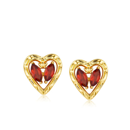 Pair of gold heart-shaped L’Art du Cœur stud earrings featuring two marquise-cut natural garnets in a butterfly configuration inside a textured frame.