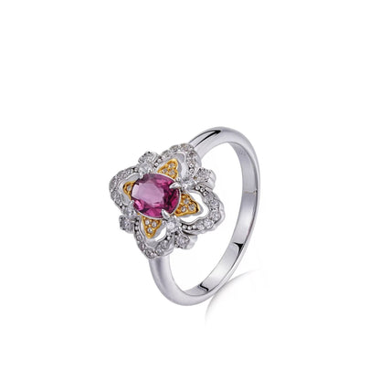 Awakened Time La Rosa di Firenze ring featuring a deep plum pyrope-almandine garnet center stone set in dual-tone 18ct recycled gold and white gold vermeil with a cubic zirconia halo.