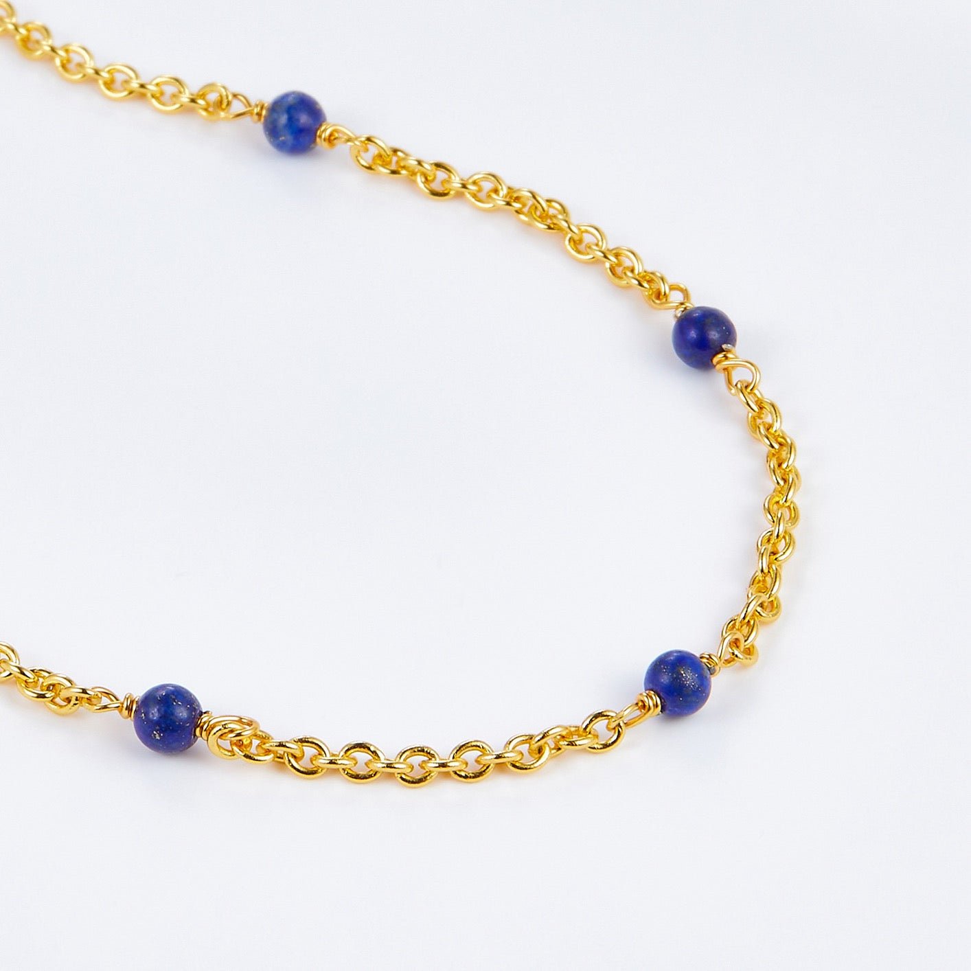 Delicate gold vermeil chain necklace accented with blue lapis lazuli beads