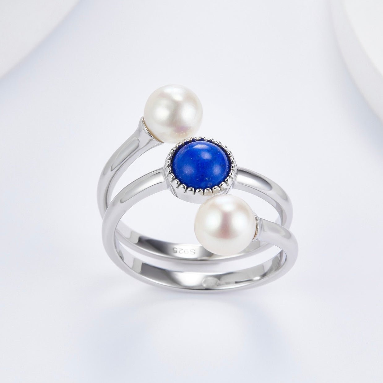 Awakened Time Pearl Cosmos luxury statement ring displayed on a clean white background, highlighting its natural deep blue lapis lazuli, dual freshwater pearls, and 18ct white gold vermeil craftsmanship with an S925 hallmark.