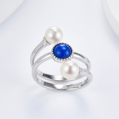 Awakened Time Pearl Cosmos luxury statement ring displayed on a clean white background, highlighting its natural deep blue lapis lazuli, dual freshwater pearls, and 18ct white gold vermeil craftsmanship with an S925 hallmark.