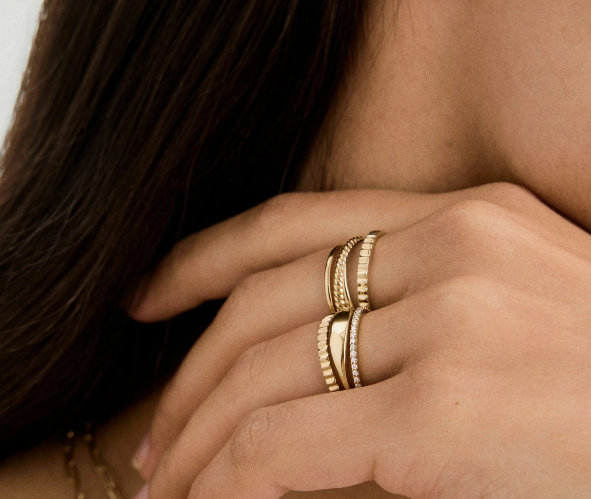 Ring size conversion chart comparing US, European, UK, circumference, and diameter measurements for Awakened Time jewelry
