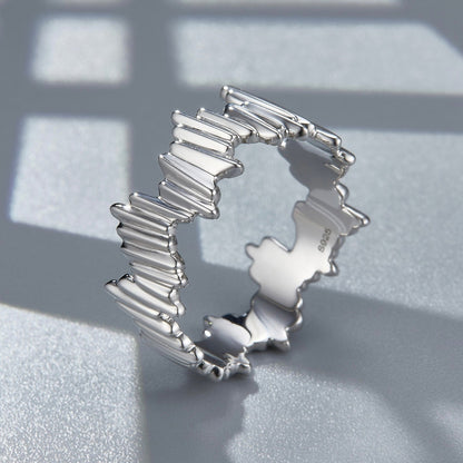 Awakened Time Silver Shard Irregular luxury statement ring in a studio angled display, showcasing its sculptural jagged silhouette, 18ct white gold vermeil finish, and S925 hallmark against a geometric background.