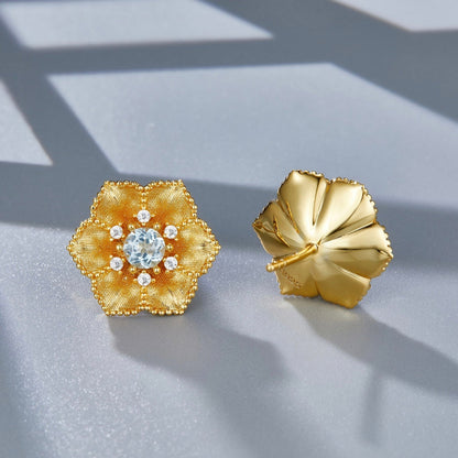 Front and back view of the Soleia Bloom stud earring highlighting the floral petal detail and solid gold back post.